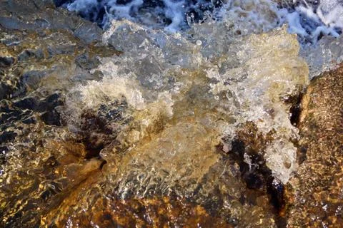 Water stream cascade falling on the rocks close up Stock Photos
