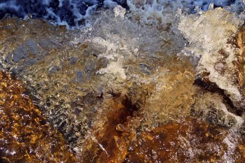 Water stream cascade falling on the rocks close up Stock Photos