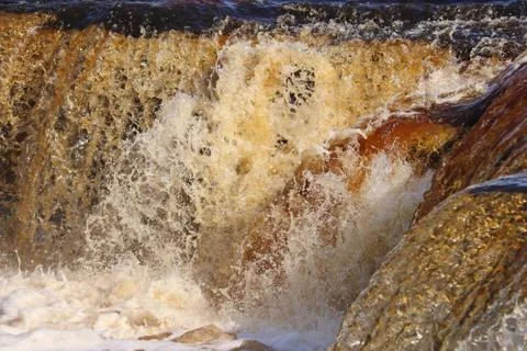 Water stream cascade falling on the rocks close up Stock Photos