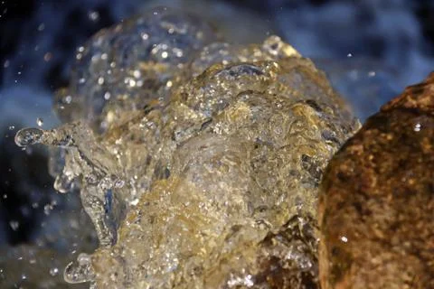 Water stream cascade falling on the rocks close up Stock Photos