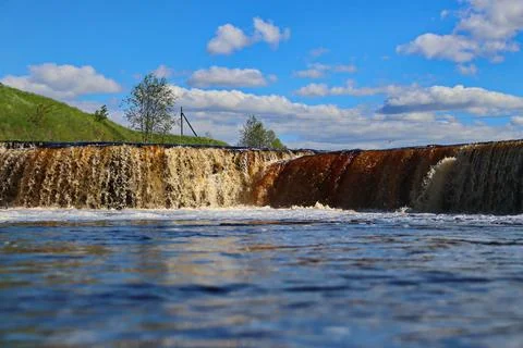 Water stream cascade falling on the rocks close up Stock Photos