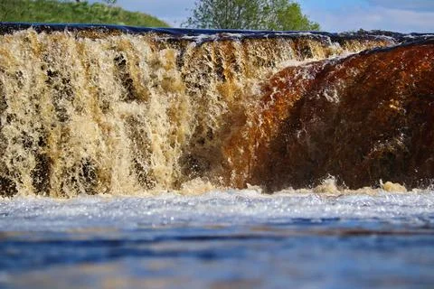 Water stream cascade falling on the rocks close up Stock Photos