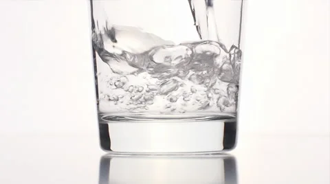 A water stream into a clear glass Stock Footage 58669239