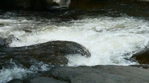 Water stream flowing on rock Stock Footage 107779918