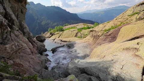 Water Stream Flows Among Rocks Stock-Footage 89517631