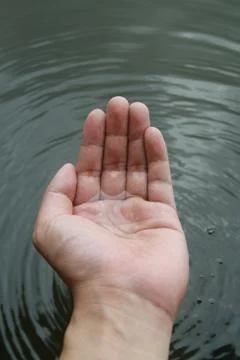 Water stream on hand Stock Photos