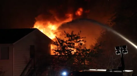 Water stream hitting house fire Stock-Footage 55771388