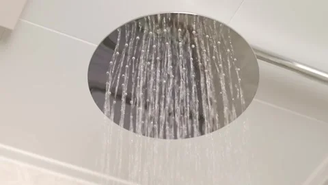 Water Streaming from Modern Chrome Shower Head, Close-up Stock Footage 336563421