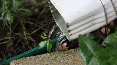 Water streaming out of a downspout Stock Footage 44444460
