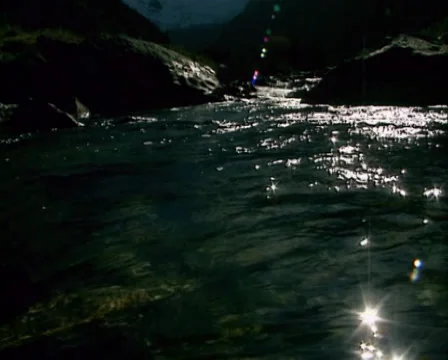 Water streaming over boulders - on camera low angle Stock Footage 31748367