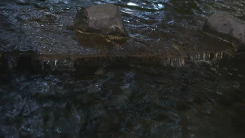 Water streaming on a stone surface of a river. Stock Footage 167340352