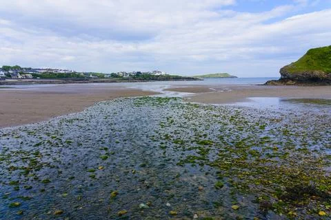 Water streams down Cemaes beach near Llanbadrig, Anglesey. Stock Photos