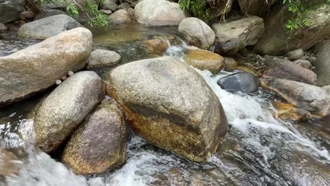 Water streams flow through rock in Cambodia 库存影片 336781829