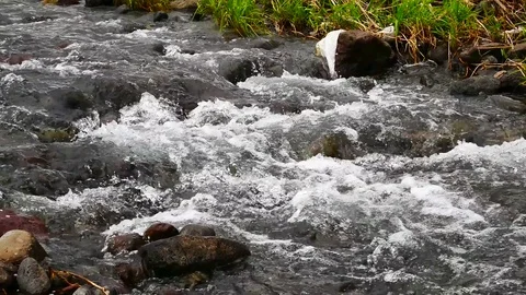 The water in streams flowing through the Weir. Stock Footage 75217611