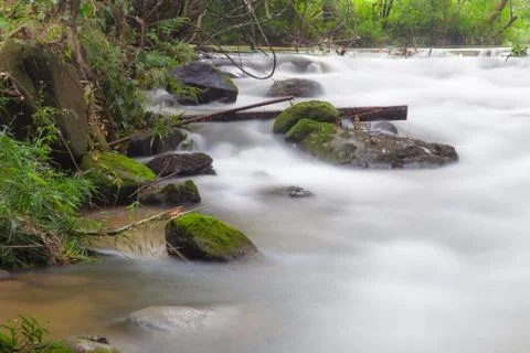 Water in streams Stock Photos