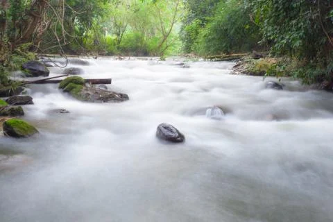 Water in streams Stock Photos
