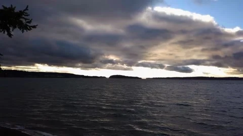 Water at Sunset BETWEEN TWO TREES Stock Footage 196477047