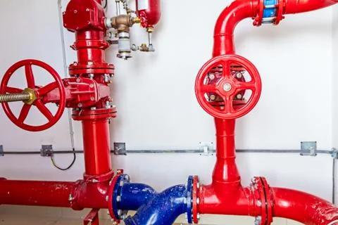 Water supply, fire fighting system control, painted pipeline Stock Photos
