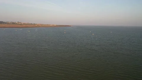 Water surface along coastline, signalling buoys in water Video stock 161003002