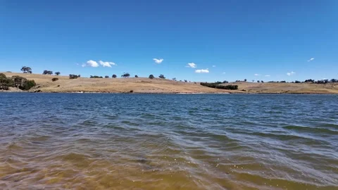 Water surface and rolling hills at Lauriston Reservoir near Kyneton, Australia. Stock Footage 335964840