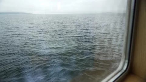 Water surface captured from a ferry in Norway through a window Video stock 237438830