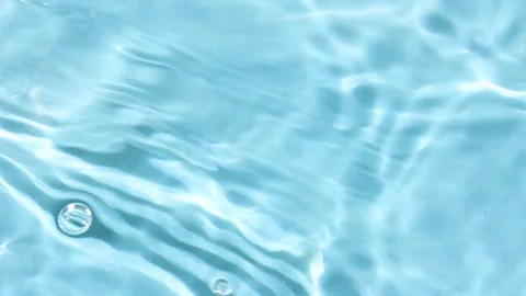 Water surface on light blue background. Video stock 250738858