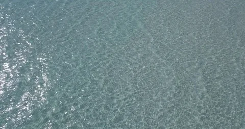 Water surface with light reflections and small ripples, aerial Stock Footage 111770554