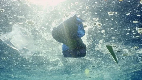 Water surface in ocean is covered with layer of fat and plastic debris Stock Footage 236105181