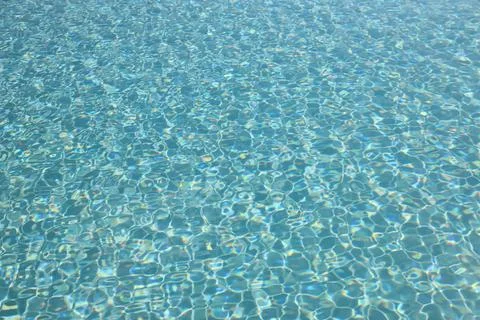 Water surface of a pool on a bright day Stock Photos