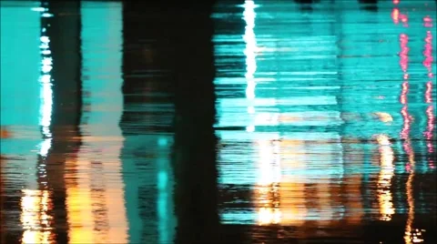 Water surface reflecting multicolored changing lights in abstract pattern Stock Footage 41197136