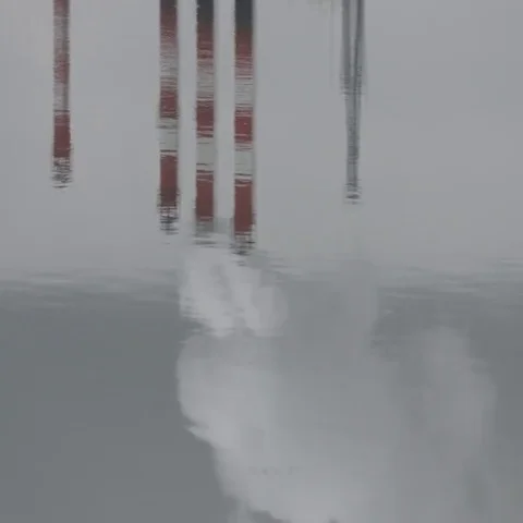 Water surface reflections of power plant pipes with heavy clouds of pollutions Video stock 69547266