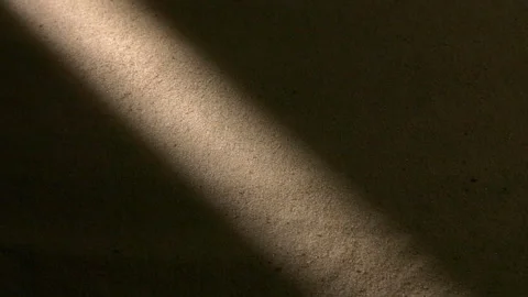Water surface ripples and splashes, bright light and shadow on dark sand texture Stock Footage 276153163