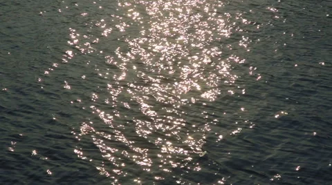 Water surface ripples, reflecting the sun. 動画素材 41750133