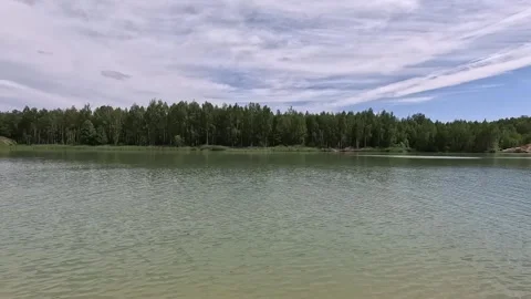 The water surface of the river with an edge of green trees on the horizon Stock Footage 287731187