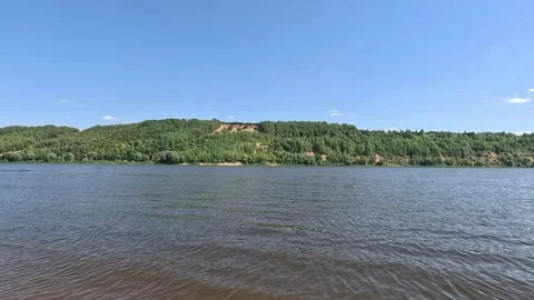 The water surface of the river with an edge of green trees on the horizon Stock Footage 287731503