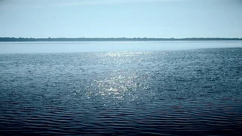 Water surface in a river or lake sparkling in sun Stock Footage 72897245