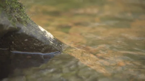 Water surface at a rock Stock Footage 97939108