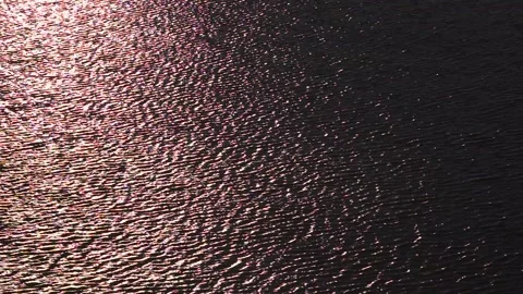 Water surface in the setting sun. bright colors are reflected on water surface Stock Footage 97816786