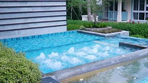 Water surface splashing and bubble rising in swimming pool Stock Footage 100533555