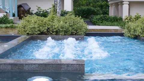 Water surface splashing and bubble rising in swimming pool Stock Footage 100569119