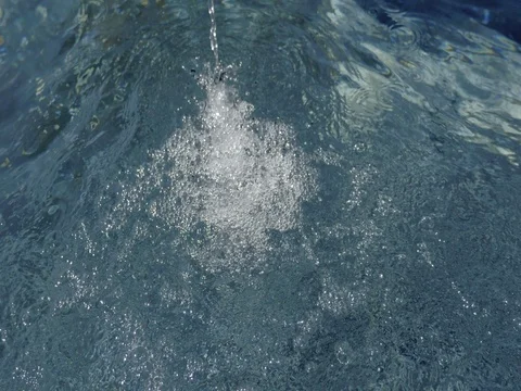 Water surface with stream of falling water. Decreasing water level. Stock Footage 75168121