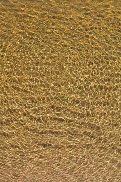 Water surface with sun rays. Stock Photos