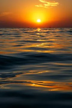 The water surface at sunset. Stock Photos