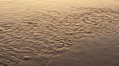 Water surface at sunset on a summer evening. Light wave, ripples, soothing and Stock-Footage 111430113