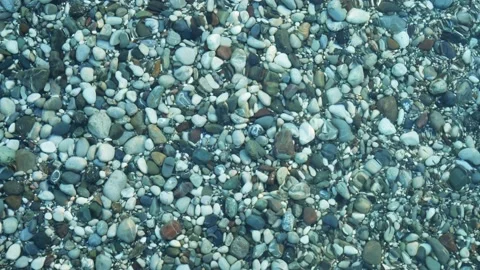 Water surface texture. Top view seabed with pebbles. Water caustic background Stock Footage 154966500