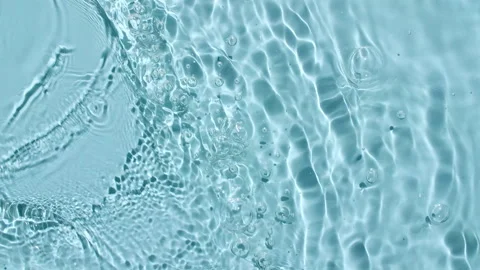 Water surface texture top view. Water splash blue colored. Sun and shadows. Pure Stock Footage 162812463