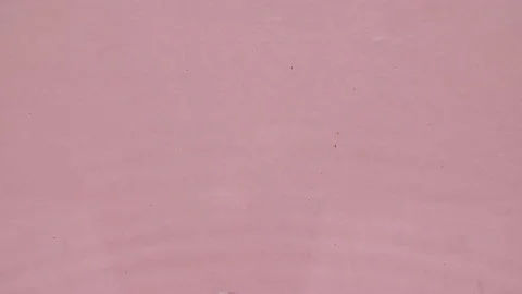 Water surface texture top view. Water splash pink colored. Pure blue water with Stock Footage 169590917