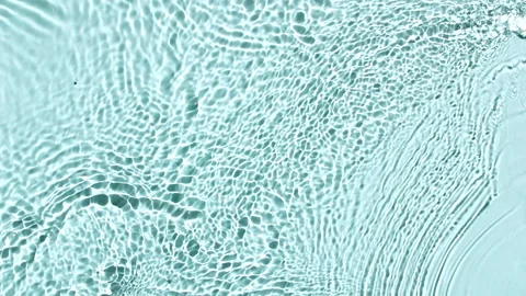 Water surface texture top view. Water waves blue colored. Sun and shadows. Pure Stock Footage 252144815