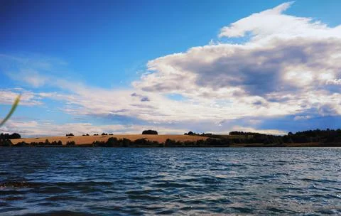 Water surface. The texture of the water. Waves on the lake in windy weather. Stock Photos