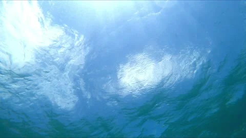 Water surface underwater view of clear mediterranean sea and beams of light Stockbeeldmateriaal 138082933